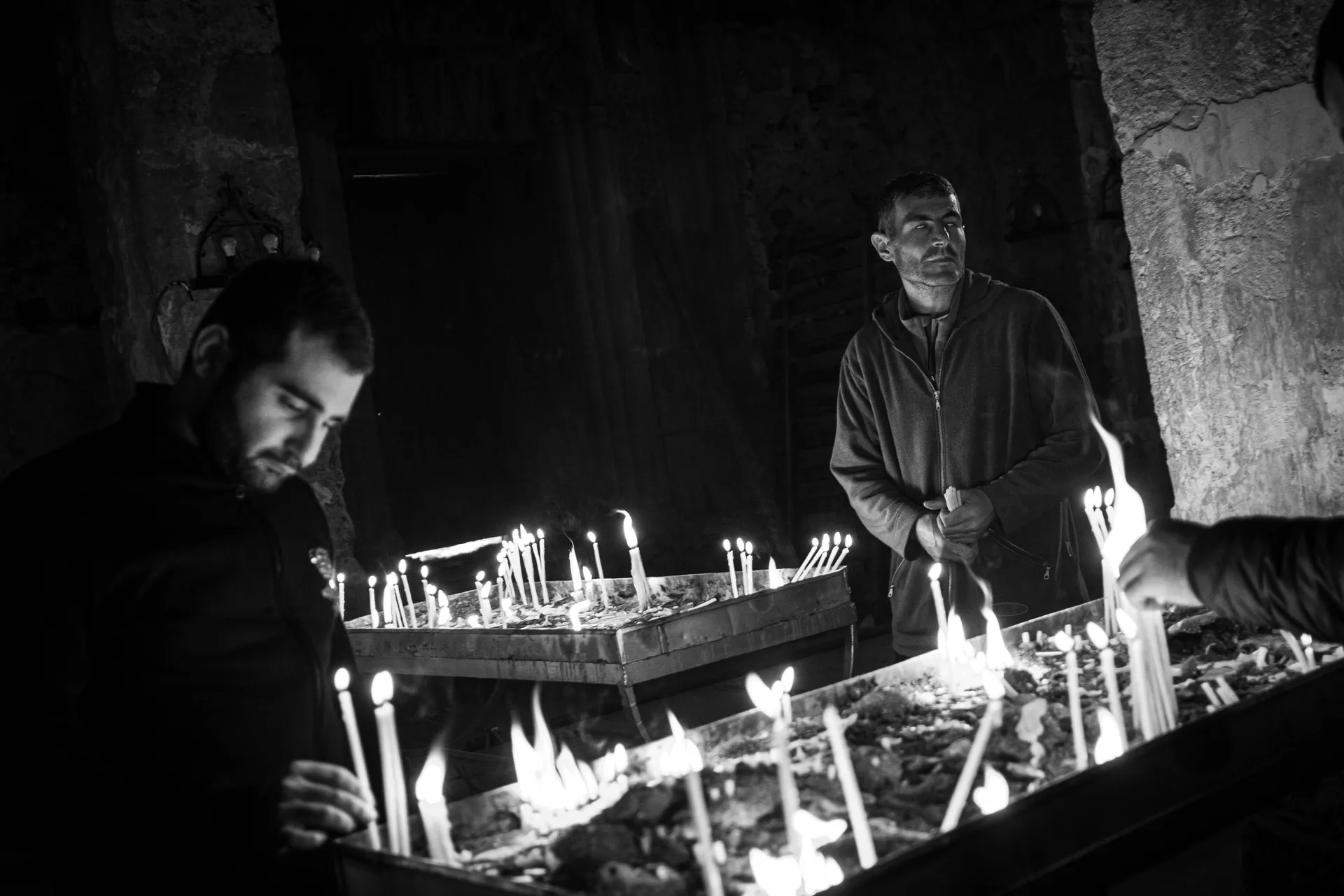 Men praying in Dadivank Monastery – Karabakh