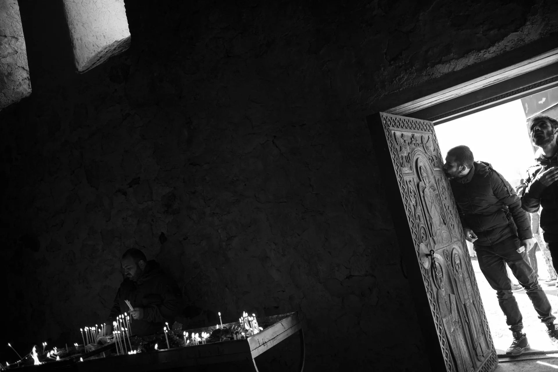 Men bidding a final farewell to Dadivank Monastery in Nagorno-Karabakh at the end of the war