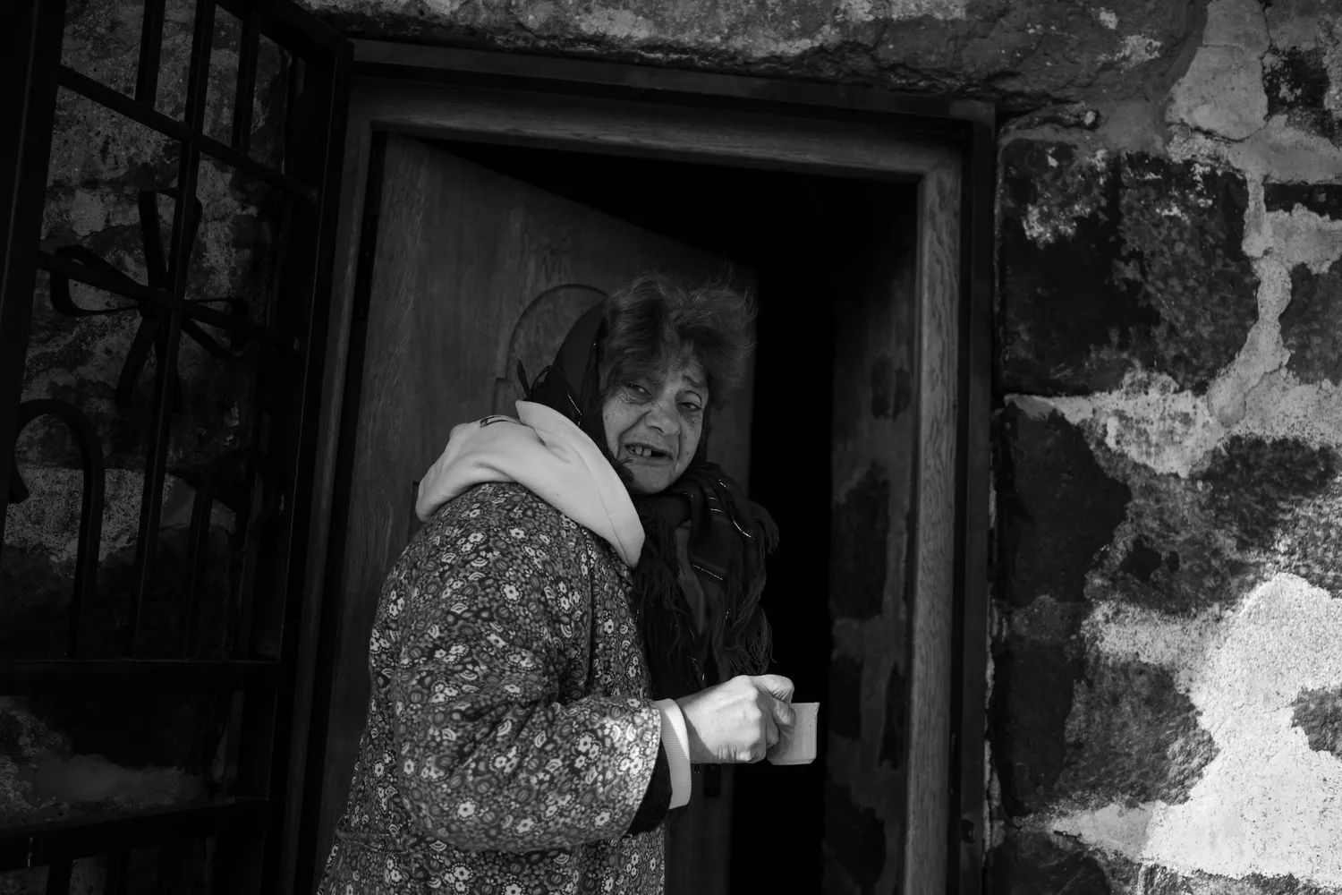 A woman inviting me to enter a church, Sevan