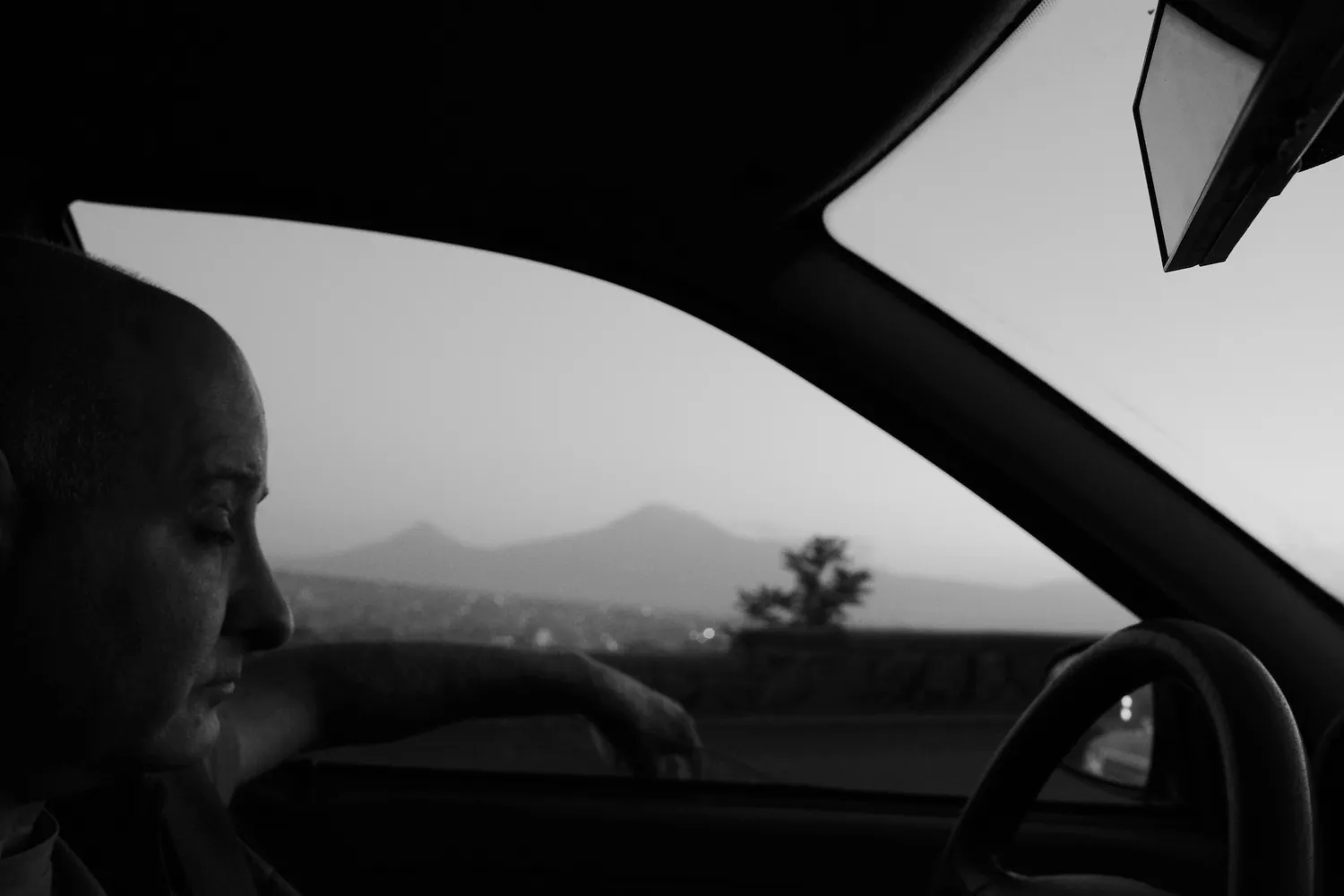 A taxi driver driving, with Mount Ararat, the mythical mountain, in the background – Yerevan