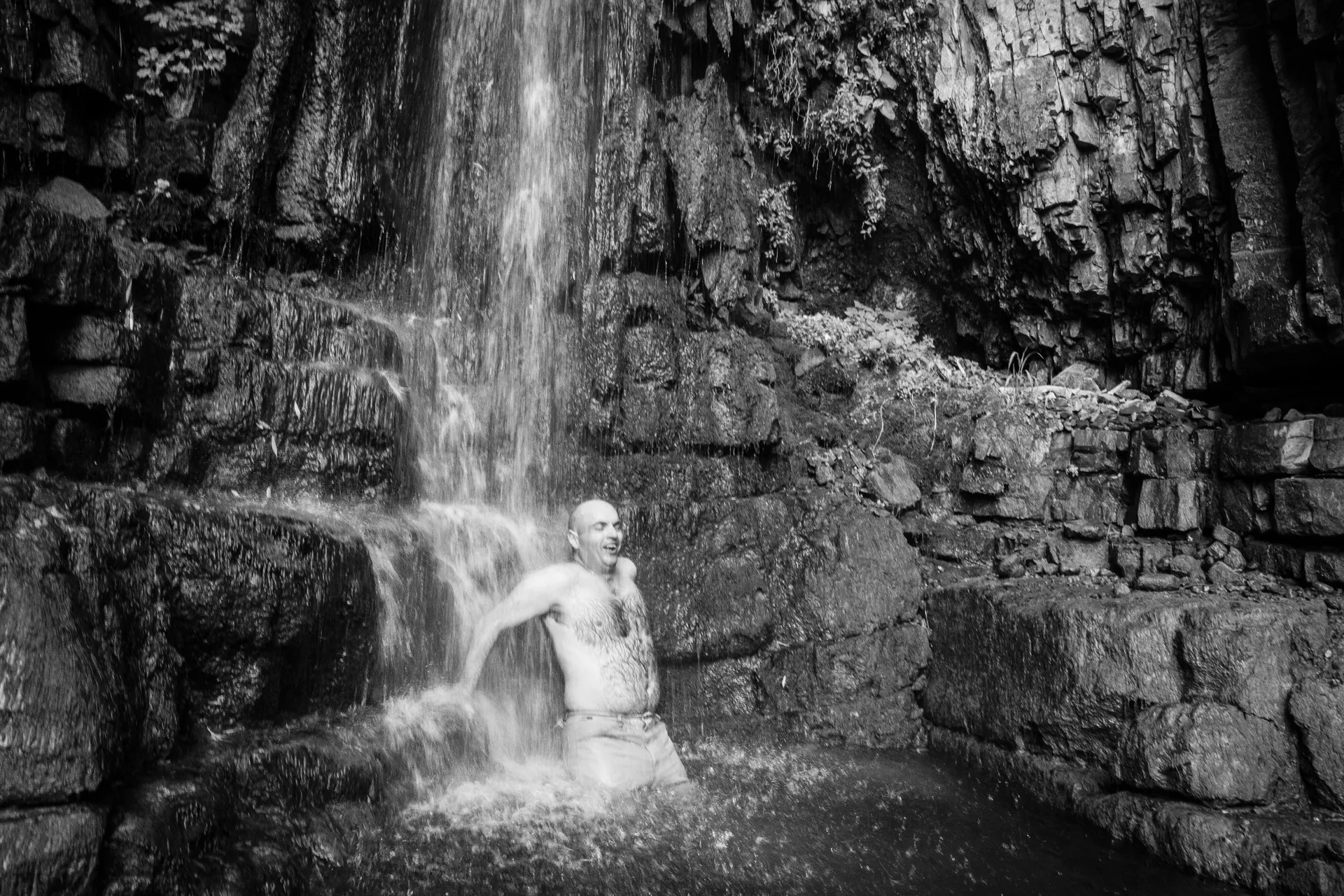 A friend washing under a small waterfall, somewhere around Garni