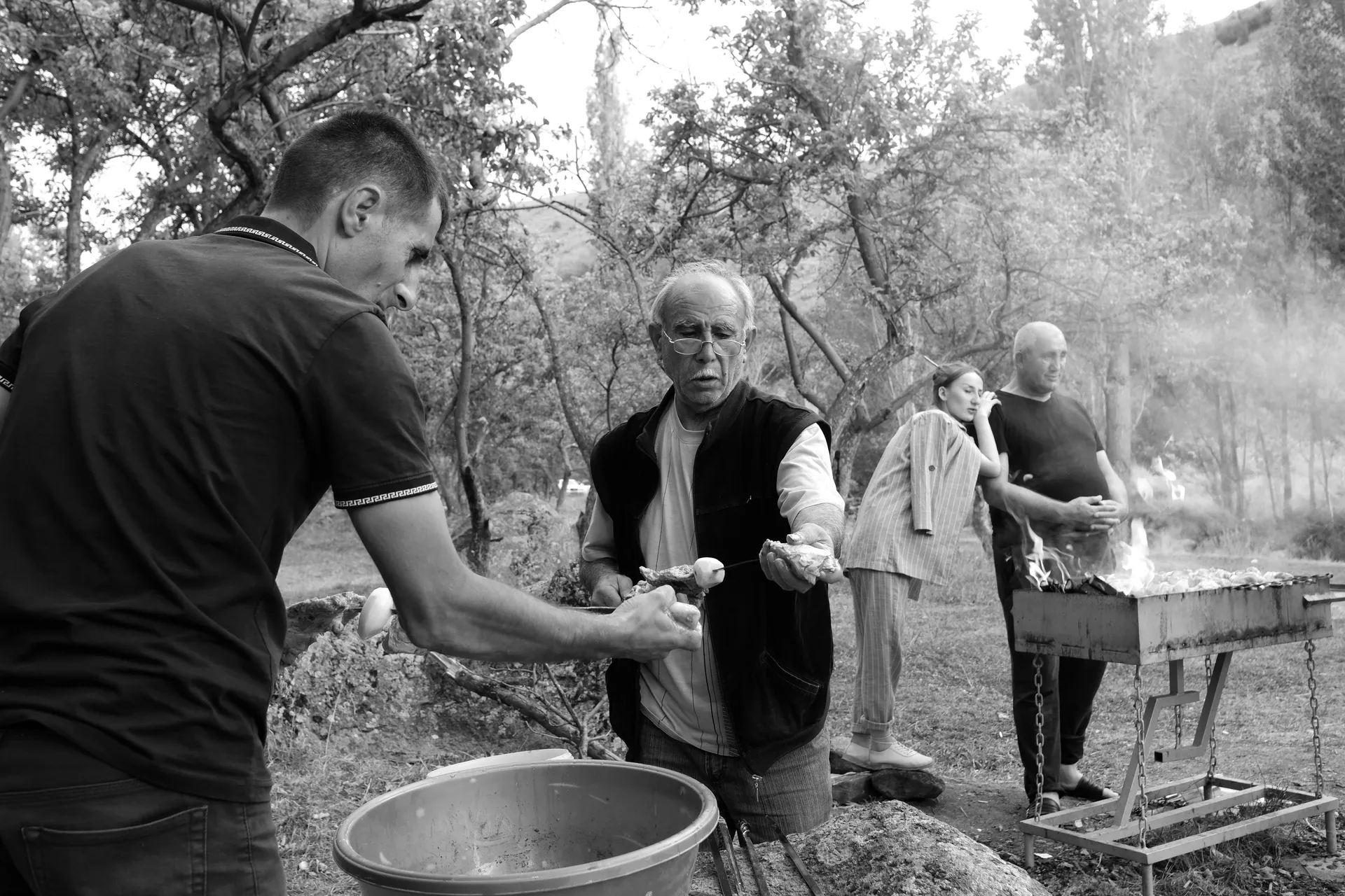 A family making a khorovats, the typical Armenian barbecue