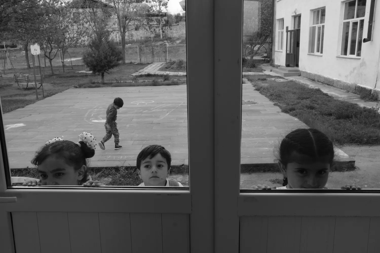 Kids having fun in a school courtyard in Kornidzor, on the border with Azerbaijan.